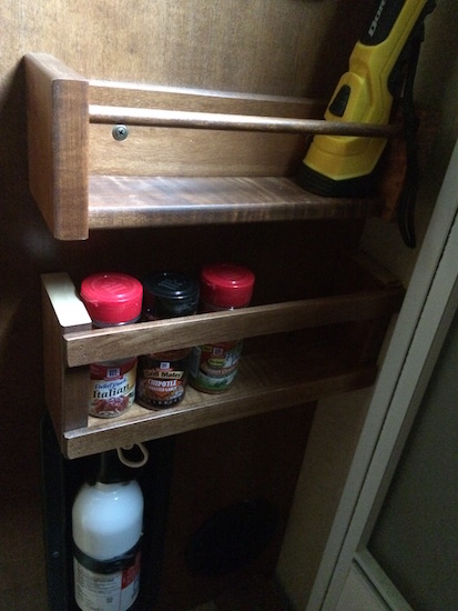 The bottom of the magazine rack repurposed into a much needed extra spice rack - added under the original spice rack.